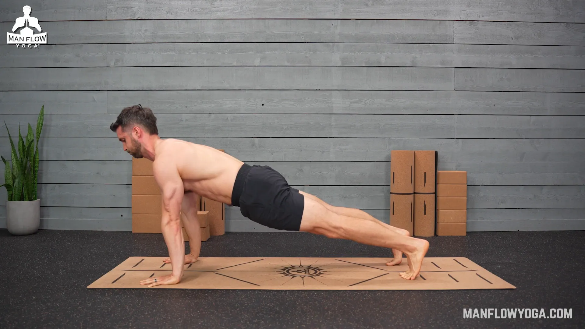 Returning to high plank position showcasing proper body alignment